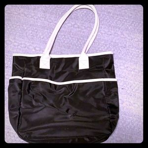 Black and white bag with front and side pockets
